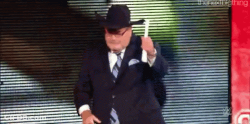 Man In Suit And Cowboy Hat Dancing On Stage GIF