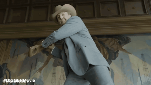 Man In Suit And Cowboy Hat In Front Of Painting #Diggermovie GIF