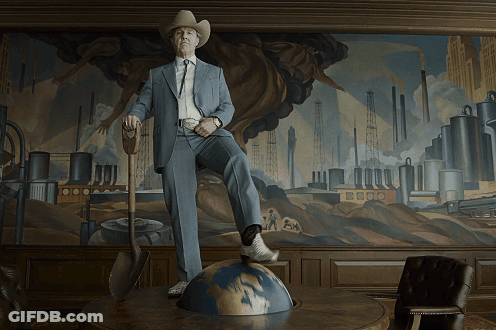 Man In Suit And Cowboy Hat Standing On Table GIF