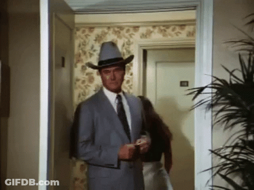 Man In Suit And Cowboy Hat Walking GIF