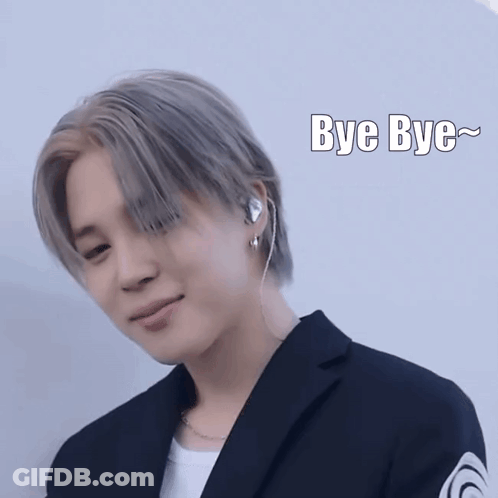 Man In Suit And Earbuds Saying Bye Bye GIF