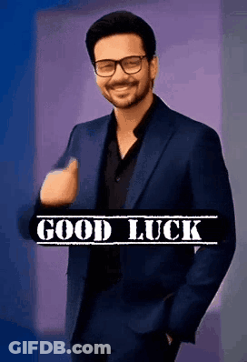 Man In Suit And Glasses Giving Thumbs Up Saying Good Luck GIF