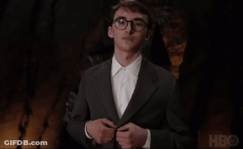 Man In Suit And Glasses In Front Of HBO GIF