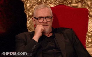 Man In Suit And Glasses In Red Chair Taskmaster GIF