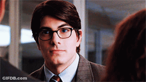 Man In Suit And Glasses Looking At Another GIF