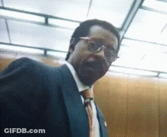 Man In Suit And Glasses Looking GIF