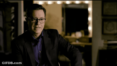 Man In Suit And Glasses Making A Face GIF