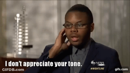 Man In Suit And Glasses Saying I Don't Appreciate Your Tone GIF