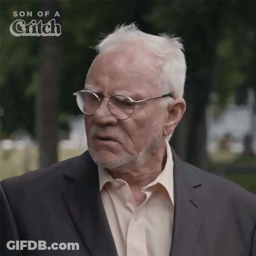 Man In Suit And Glasses Saying Jeez GIF
