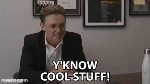 Man In Suit And Glasses Saying Y Know Cool Stuff GIF