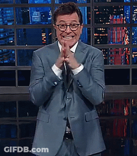Man In Suit And Glasses Smiling Clapping GIF