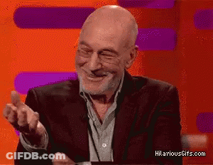Man In Suit And Glasses Smiling Hilariousgifs GIF