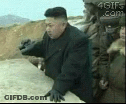 Man In Suit And Gloves On Dirt Road GIF