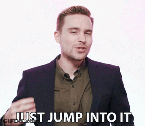 Man In Suit And Green Shirt Says Just Jump Into It GIF