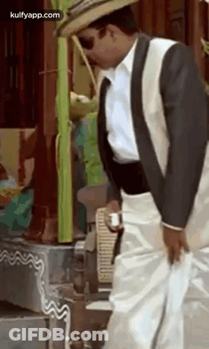 Man In Suit And Hat Holding Coffee GIF