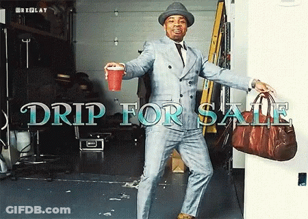 Man In Suit And Hat Holding Red Cup And Brown Bag Drip For Sale GIF
