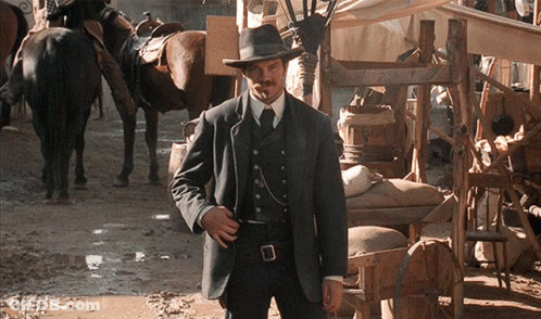 Man In Suit And Hat In Muddy Area GIF