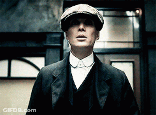 Man In Suit And Hat Looking At Camera GIF
