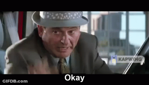 Man In Suit And Hat Making Funny Face GIF