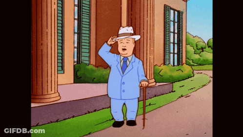 Man In Suit And Hat Saluting In Front Of Building GIF