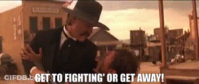 Man In Suit And Hat Says Get To Fighting Or Get Away GIF
