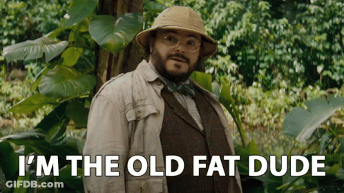 Man In Suit And Hat Says I'm The Old Fat Dude In Front Of Tree GIF