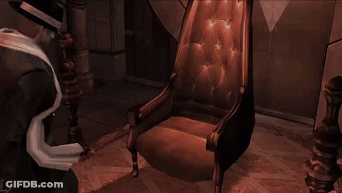 Man In Suit And Hat Sitting With Arms Outstretched GIF