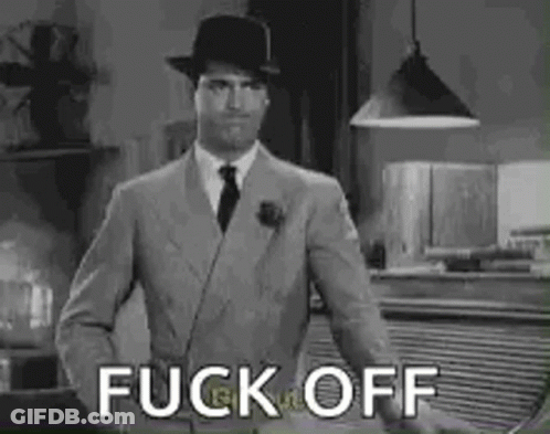 Man In Suit And Hat Standing GIF