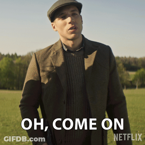 Man In Suit And Hat Standing In Field GIF