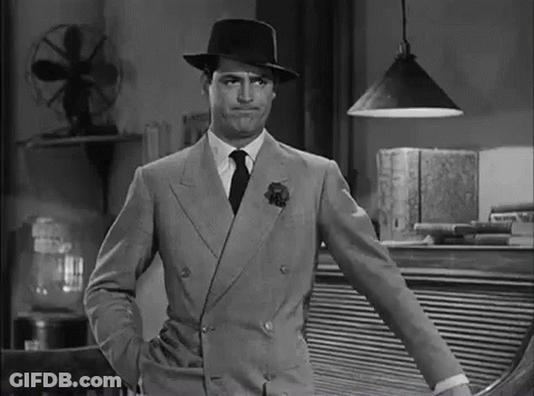 Man In Suit And Hat Standing GIF