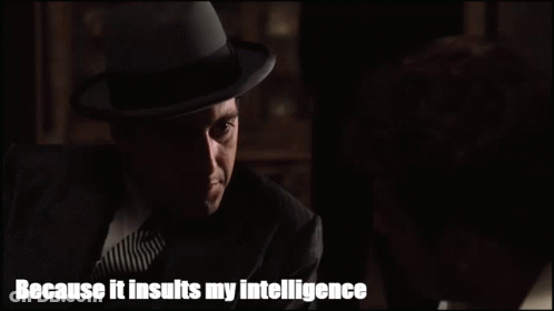 Man In Suit And Hat Talking To Another Man Saying Because It Insults My Intelligence GIF