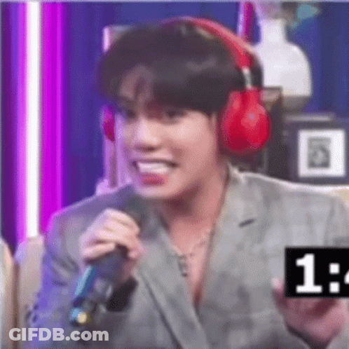 Man In Suit And Headphones Holding Microphone GIF