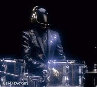 Man In Suit And Helmet At Drum Set GIF