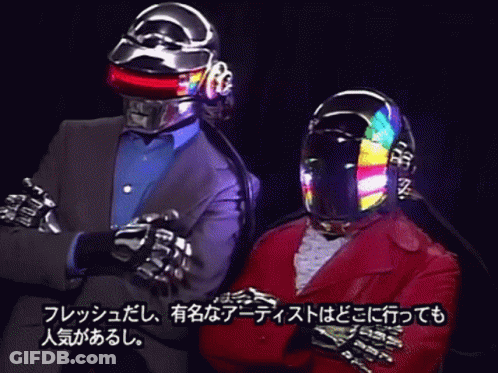 Man In Suit And Helmet Next To Man With Arms Crossed GIF