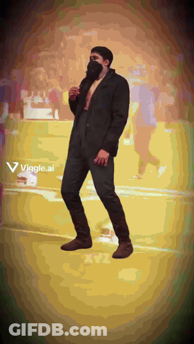 Man In Suit And Mask Dancing Viggle Ad GIF