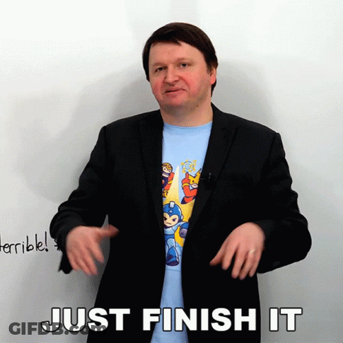 Man In Suit And Mega Man Shirt Says Just Finish It GIF