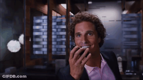 Man In Suit And Pink Shirt Talking On Cell Phone GIF