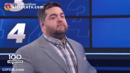 Man In Suit And Plaid Shirt Facing 100 Argentinas GIF