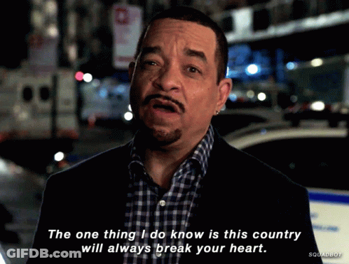 Man In Suit And Plaid Shirt Says This Country Will Always Break Your Heart GIF