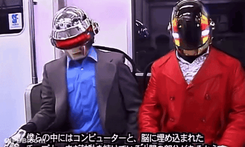 Man In Suit And Red Jacket On Subway With SF Sign GIF
