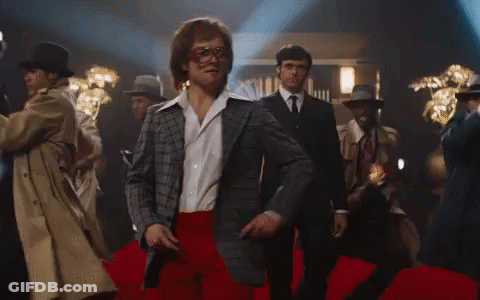 Man In Suit And Red Pants Dancing On Red Carpet GIF