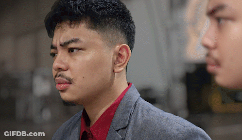 Man In Suit And Red Shirt Looking At Mirror Reflection GIF