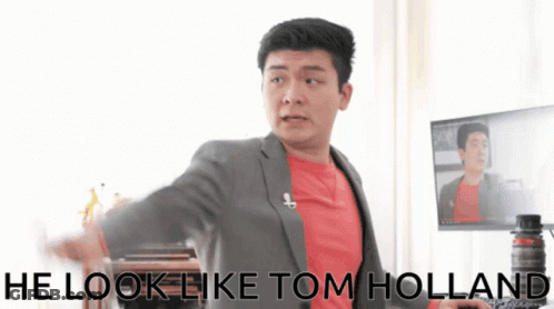 Man In Suit And Red Shirt Says He Look Like Tom Holland GIF