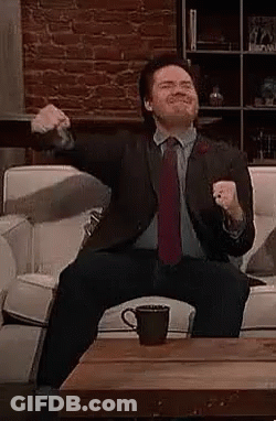 Man In Suit And Red Tie Dancing In Crowd GIF