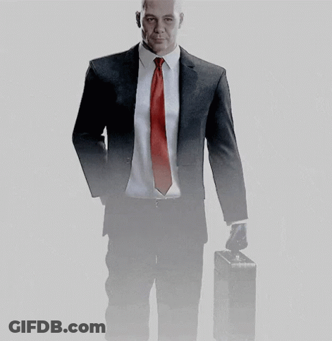 Man In Suit And Red Tie Holding Briefcase GIF