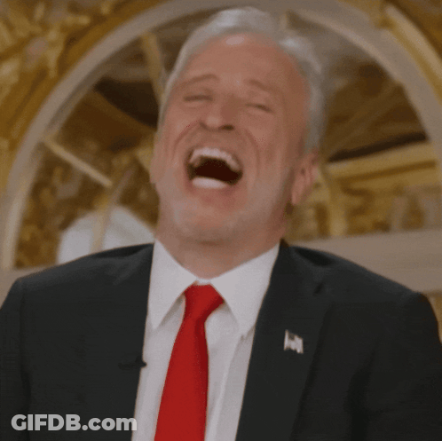 Man In Suit And Red Tie Laughing GIF