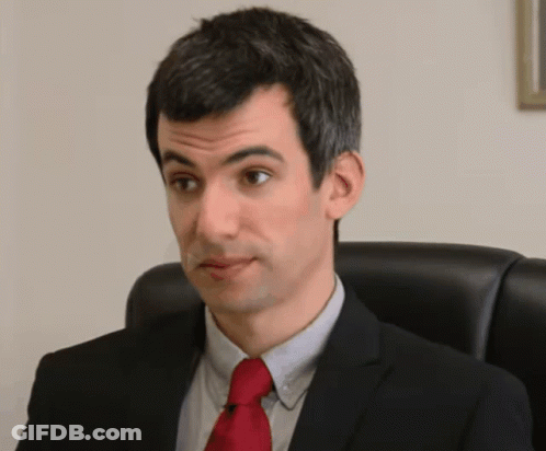 Man In Suit And Red Tie Making Funny Face GIF