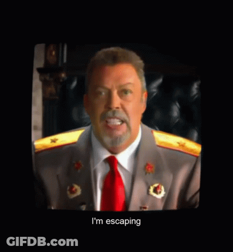 Man In Suit And Red Tie Talking To The One Place GIF