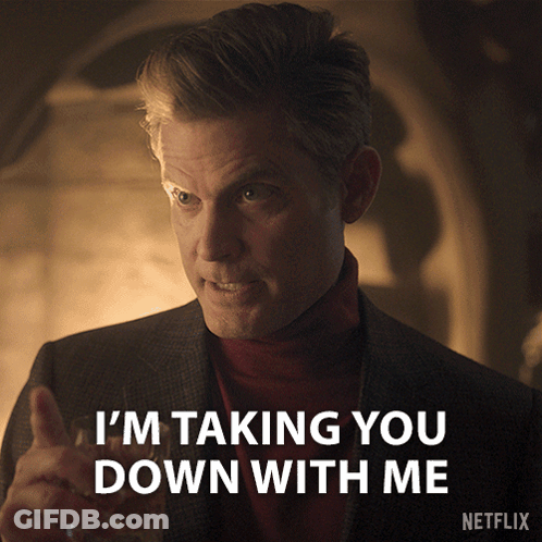 Man In Suit And Red Turtleneck Saying Taking You Down GIF