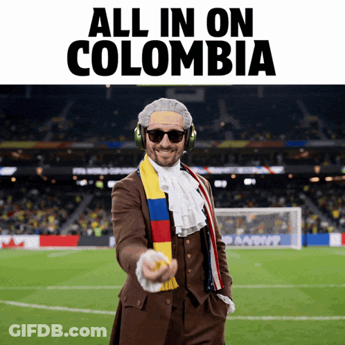 Man In Suit And Scarf Pointing All In On Colombia GIF